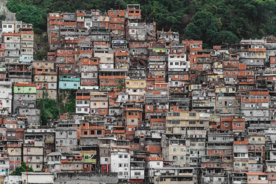 Dense informal settlement on steep hillside in Brazil.